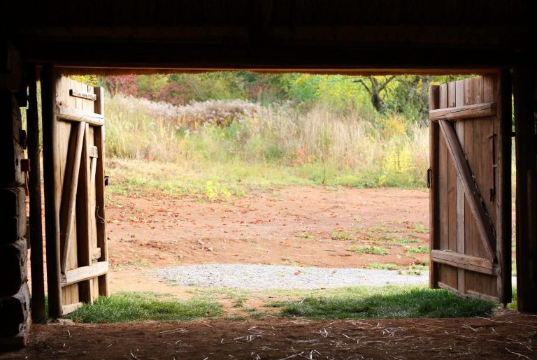 Open wooden gate old village barn