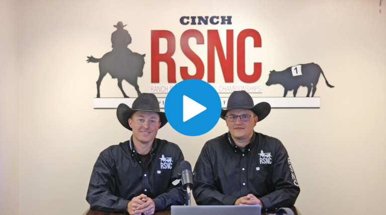 A play button over an image of two cowboys wearing black hats sitting at a desk in front of an RSNC logo