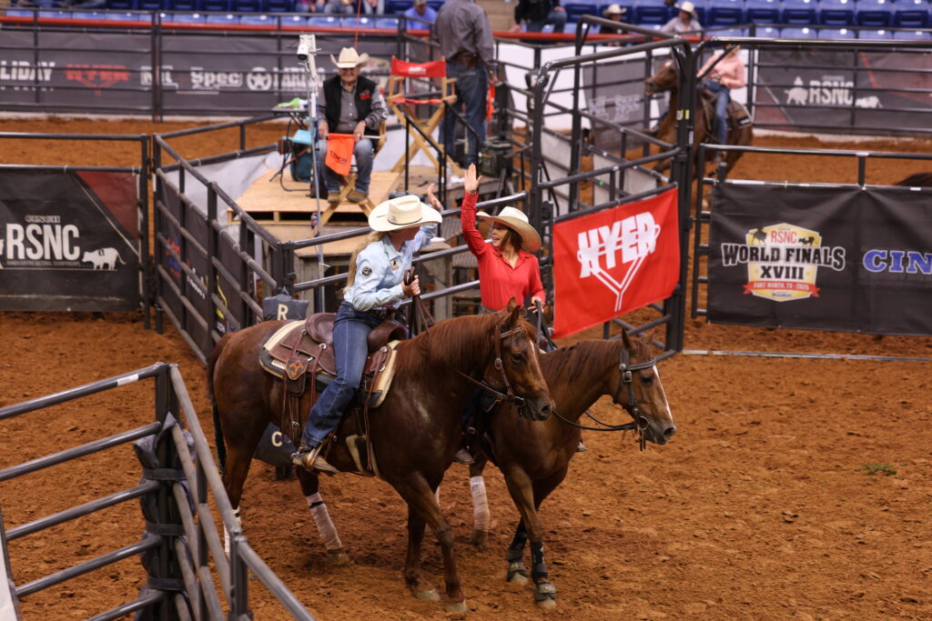 Two young cowgirls celebrate their ranch sorting run at the Cinch RSNC World Finals 2025