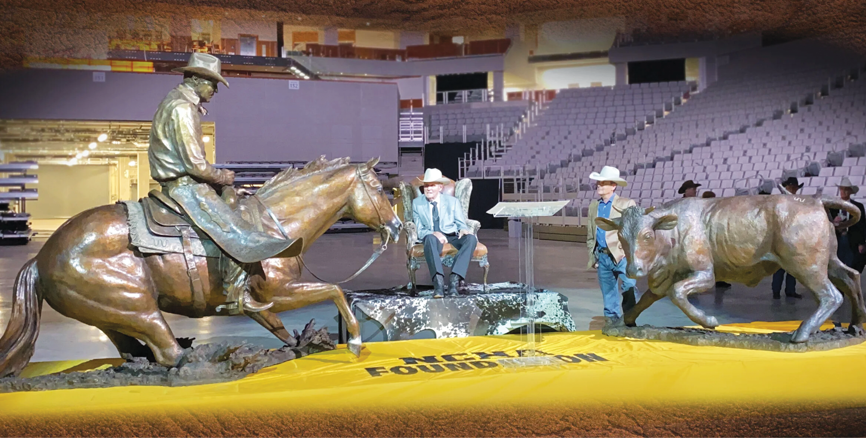 Buster Welch and sculptor Kelly Graham with the Peppy San Badger statue