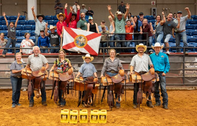 Florida's C Team celebrates with the state flag after winning the State Extravaganza at the 2026 Cinch RSNC World Finals in Fort Worth