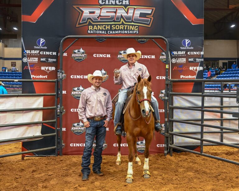 Tanner Keith on horseback holding his championship buckle at the 2026 Cinch RSNC World Finals Challenge of the Champions Open